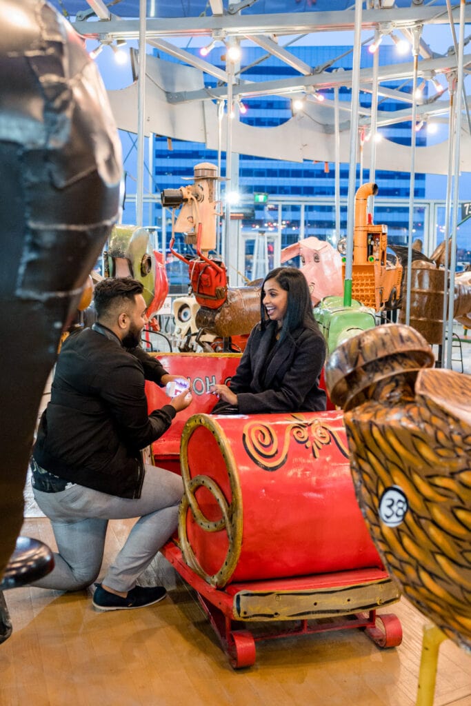 canadian surprise proposal engagement photos at toronto carousel