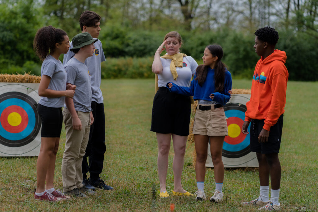 Stacey McGunnigle hugs Alina Prijono strongly outdoors in an episode of detention adventure