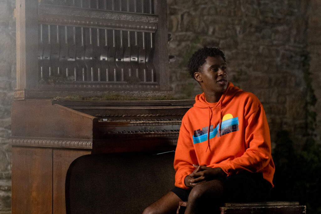 Dante Prince is playing the piano in an episode of Detention Adventure