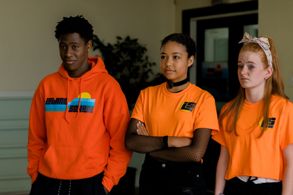 Dante Prince meets the rest of the gang at island summer camp with an orange jumper in an episode of Detention Adventure