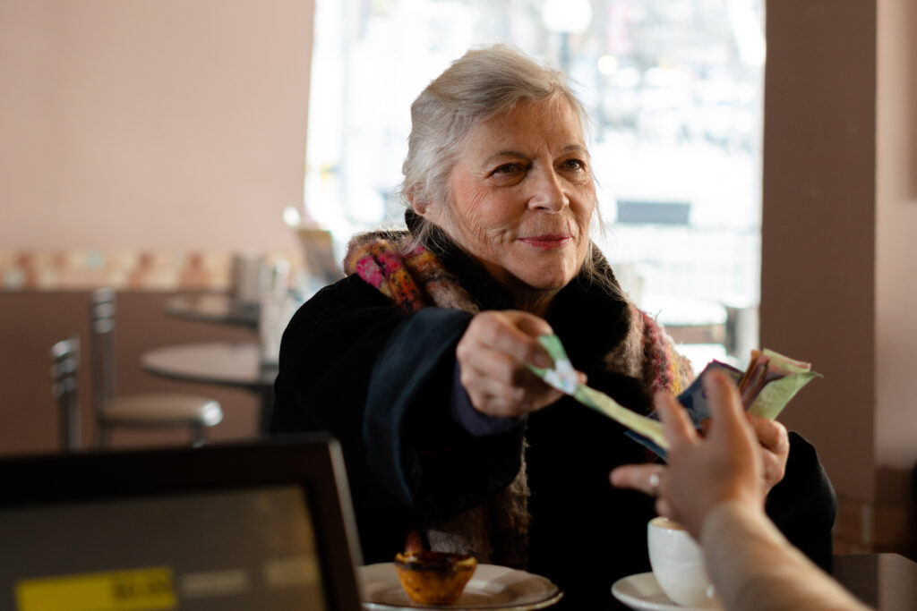 Trudy Weiss pays for her Tart in the bakery in a scene from T.A.R.T