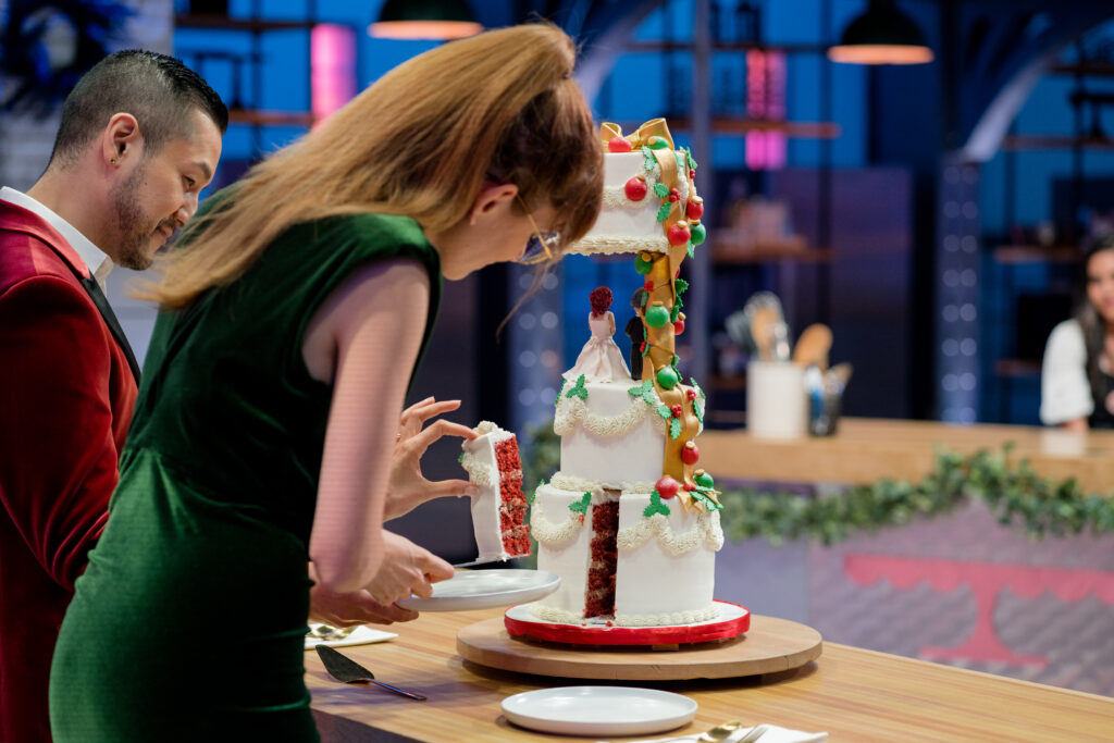 Host Mary Berg tastes one of the contestants cakes on Cross Country Cake Off