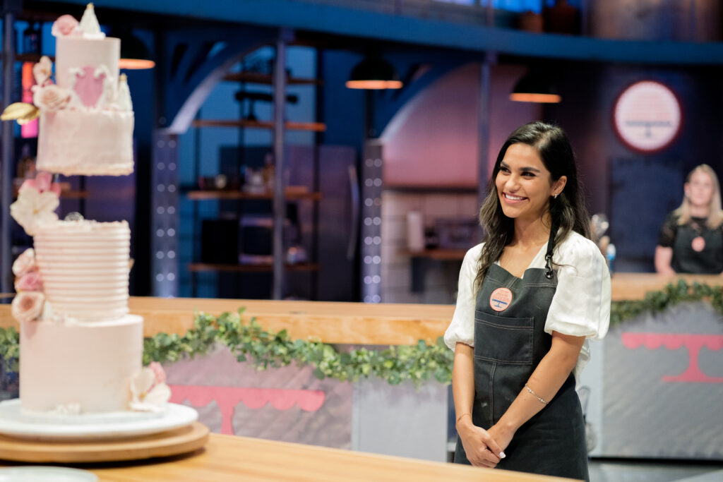Cross Country Contestant waits as her cake is judged by the judges Mary Berg and Andrew Han