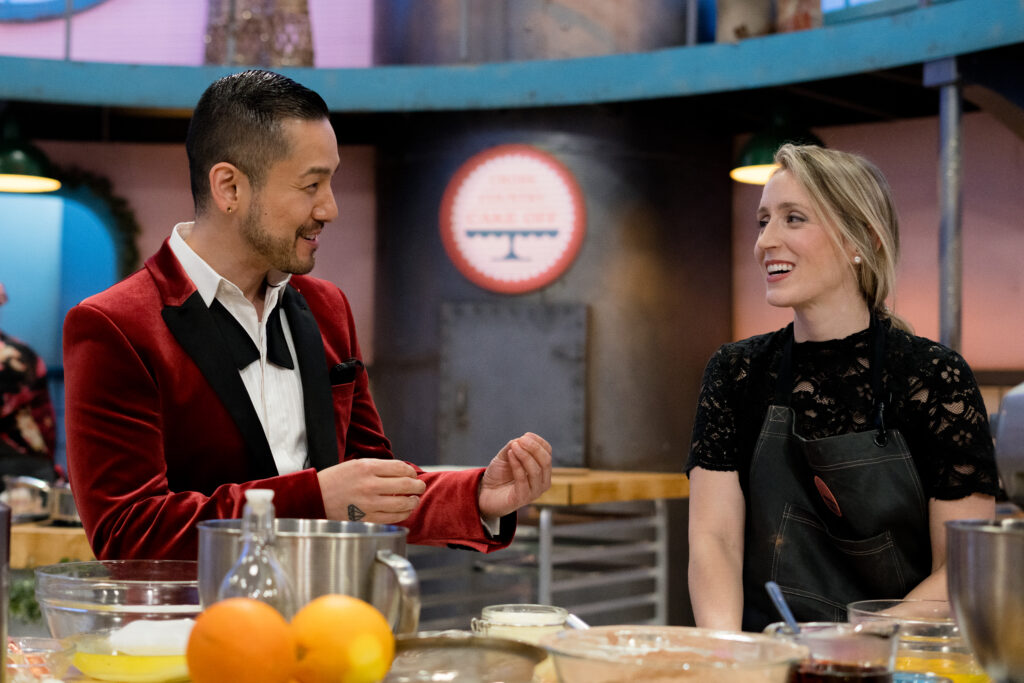 Chef Andrew Han speaks to one of Cross Country Cake Off's contestants