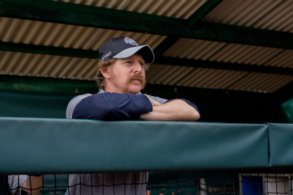 Second coach looks at baseball match being played in You Gotta Believe