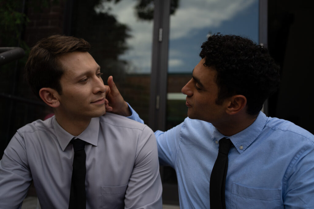 Ryan Ali and his lover have a heart to heart on the steps of the church in a scene from the movie Queen Tut