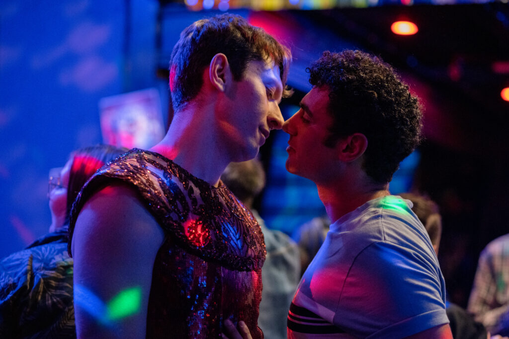 Ryan Ali is about to kiss his love interest on the dance floor of a club in a scene from the movie Queen Tut