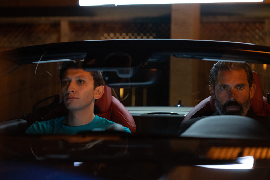 Ryan Ali has a serious talk in the car with his father in a scene from the movie Queen Tut