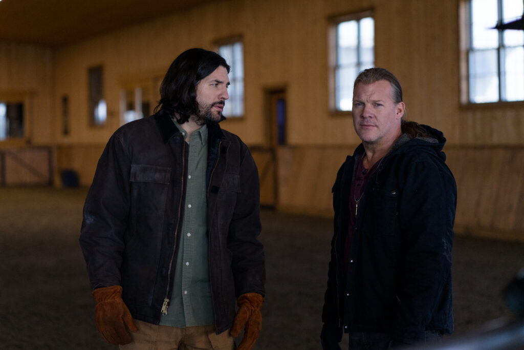 Chris Jericho and Craig Stickland talk in stables in scene from Country Hearts Christmas