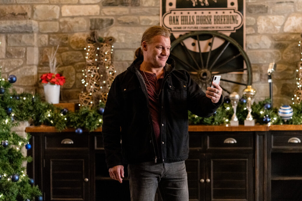 Chris Jericho speaks on facetime in scene from Country Hearts Christmas