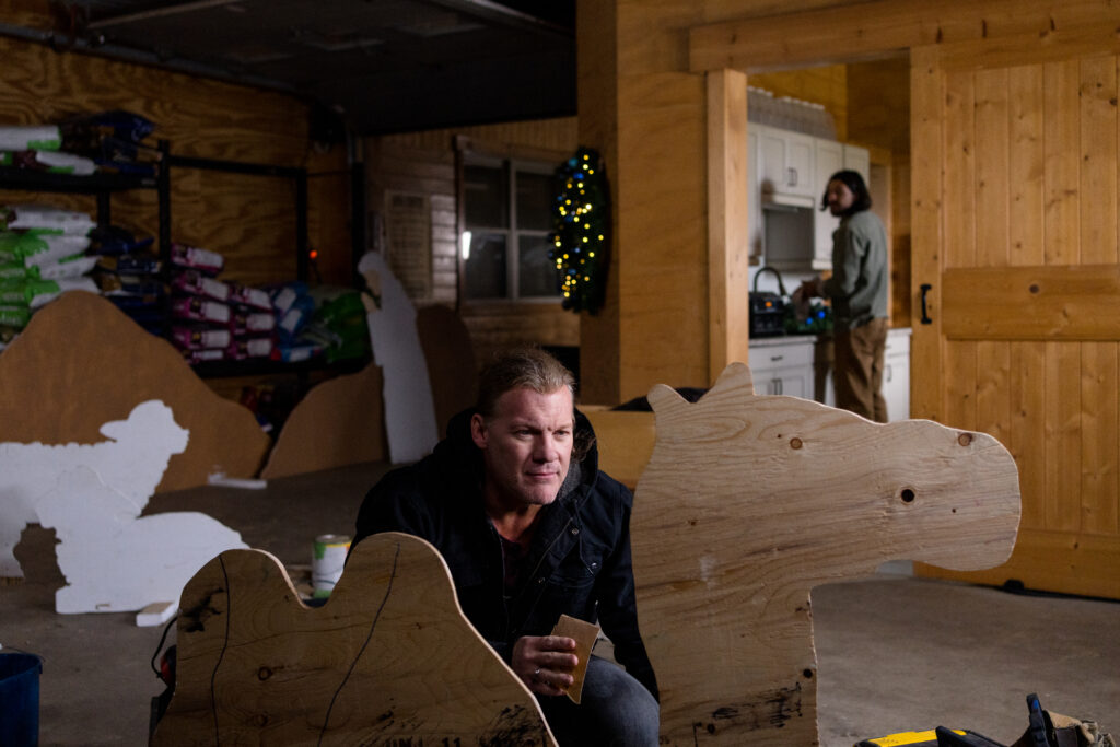 Chris Jericho paints christmas decorations in scene from Country Hearts Christmas