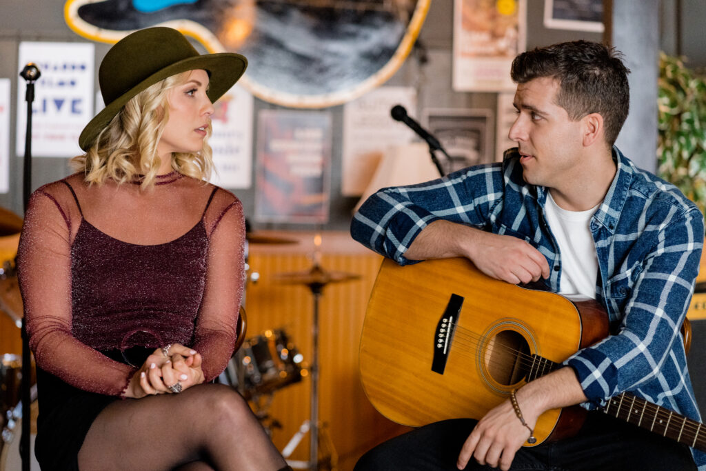 Lanie Mcauley on stage singing with guitarist David Pinard