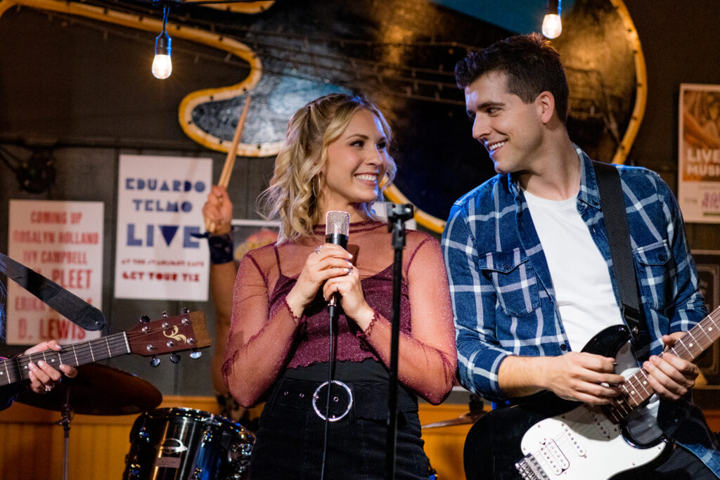Lanie Mcauley on stage singing with guitarist David Pinard