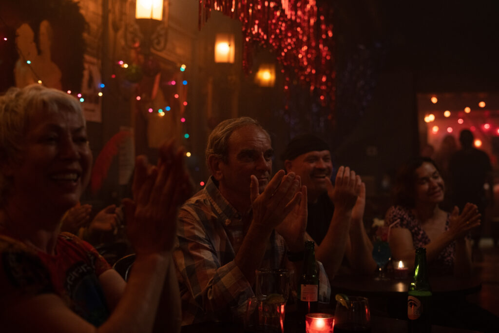 The audience applause Alexandra Billings performance in a scene from the movie Queen Tut