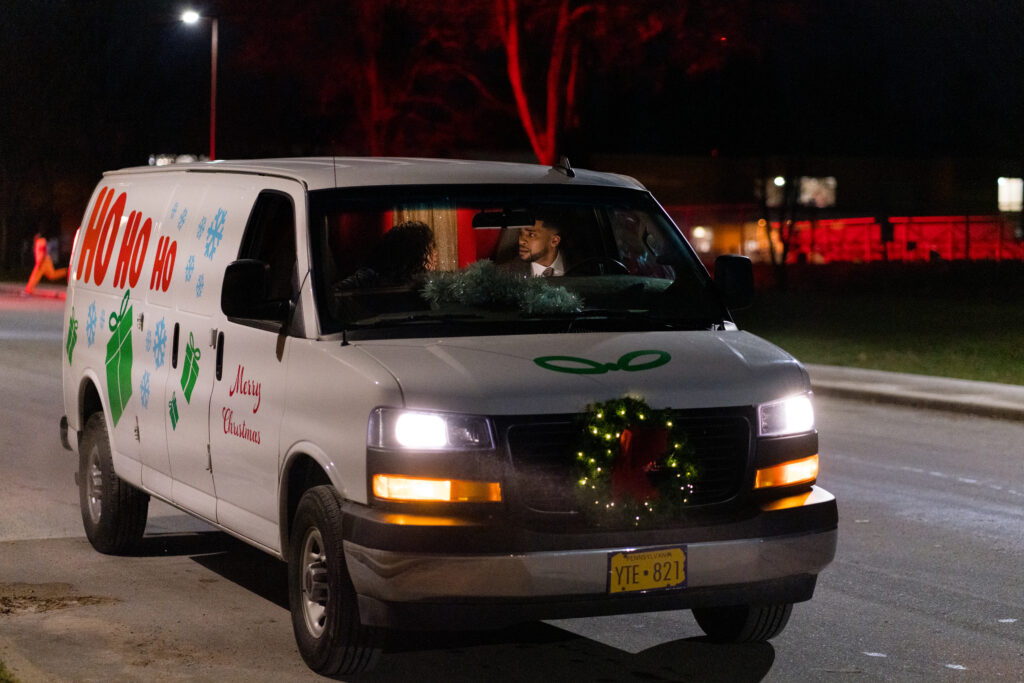 Mishael Morgan and Leland B. Martin talk in a van in a scene from Sworn Justice: Taken Before Christmas Hallmark Movie