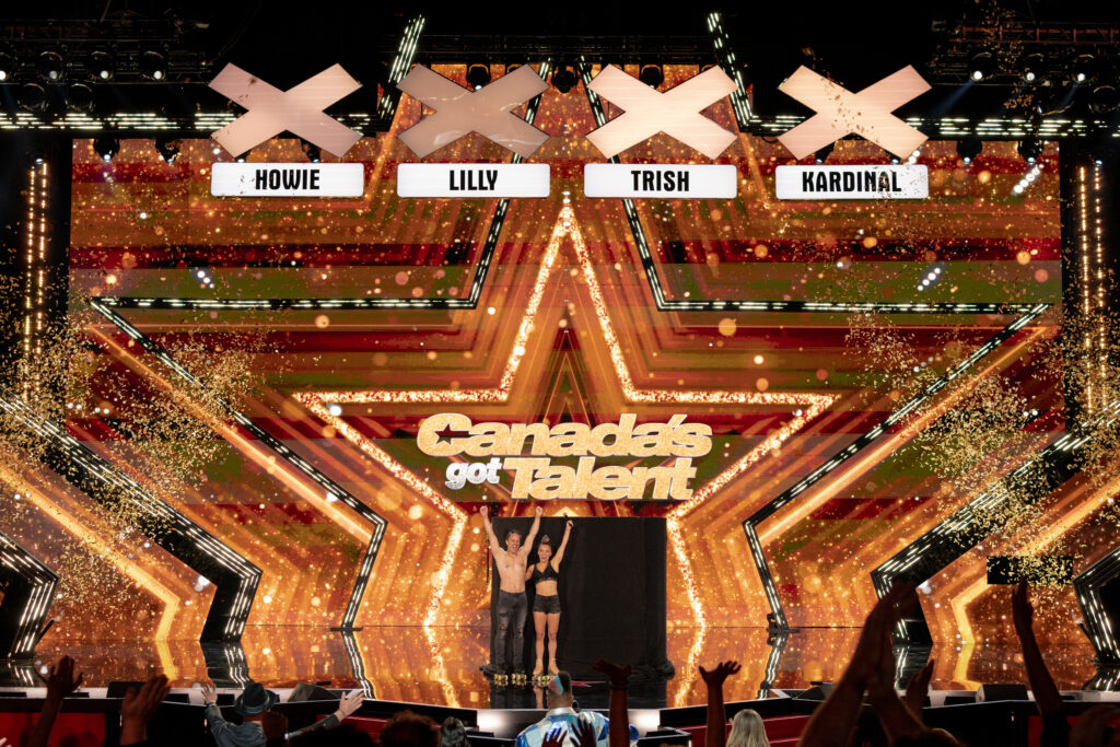 Golden Buzzer winner celebrates on stage