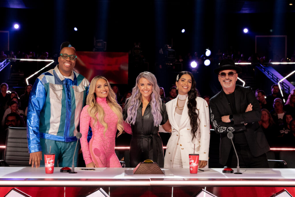 Howie Mandel, Lindsay Ell, Trish Stratus, Lilly Singh, Kardinal Offishall stand at judges desks to pose for photo during Canadas Got Talent season 4