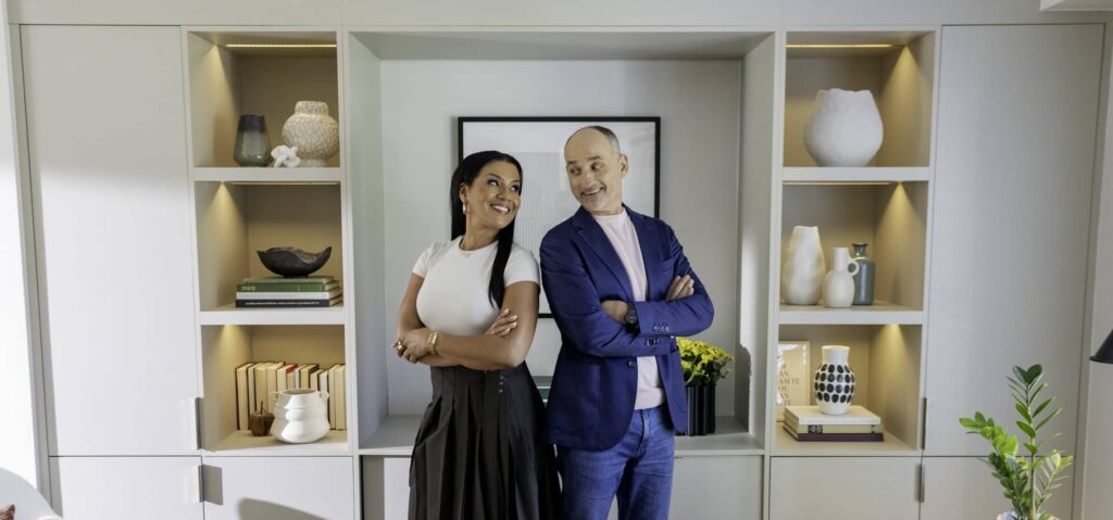 Page Turner and David Visentin pose shoulder to shoulder in newly renovated living room on love it or list it