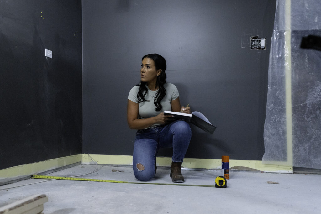 Page Turner poses for photo in Love it or List it house under renovation