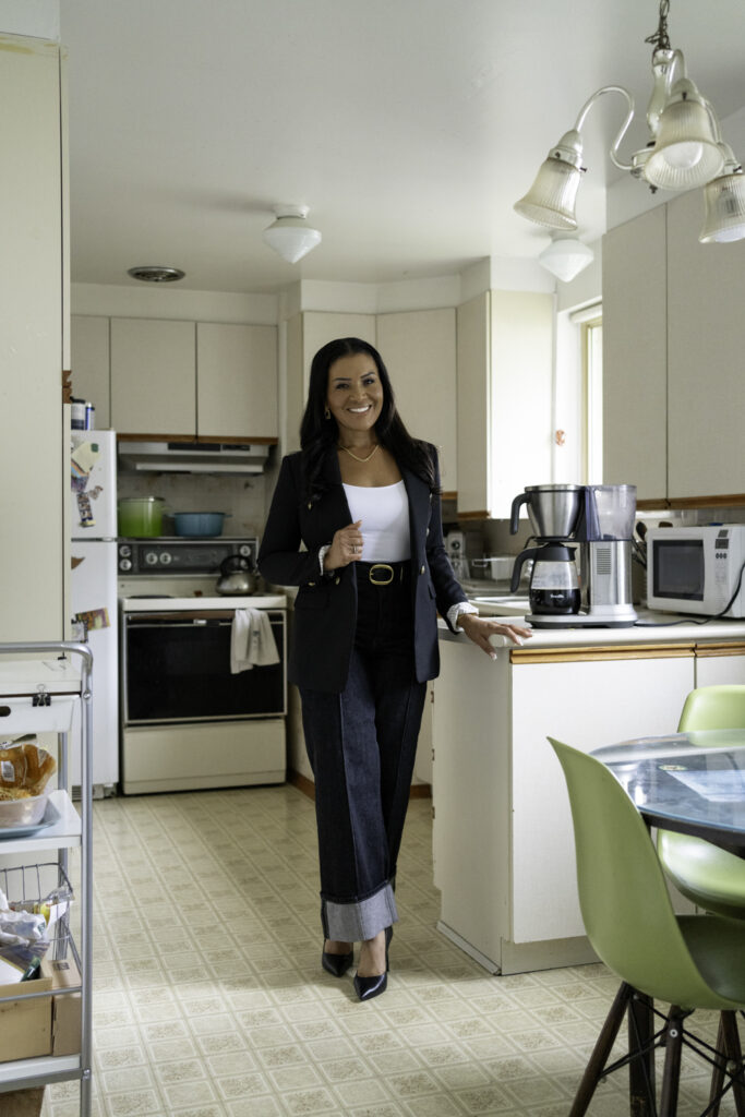 Page Turner poses for photo in Love it or List it house under renovation